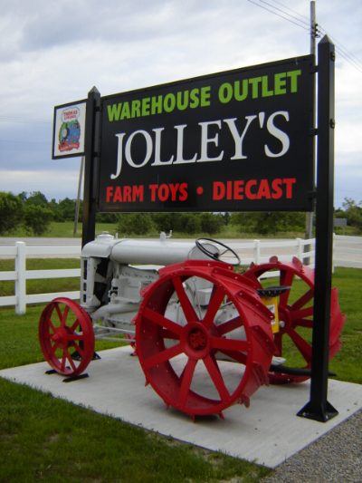 Store sign with tractor